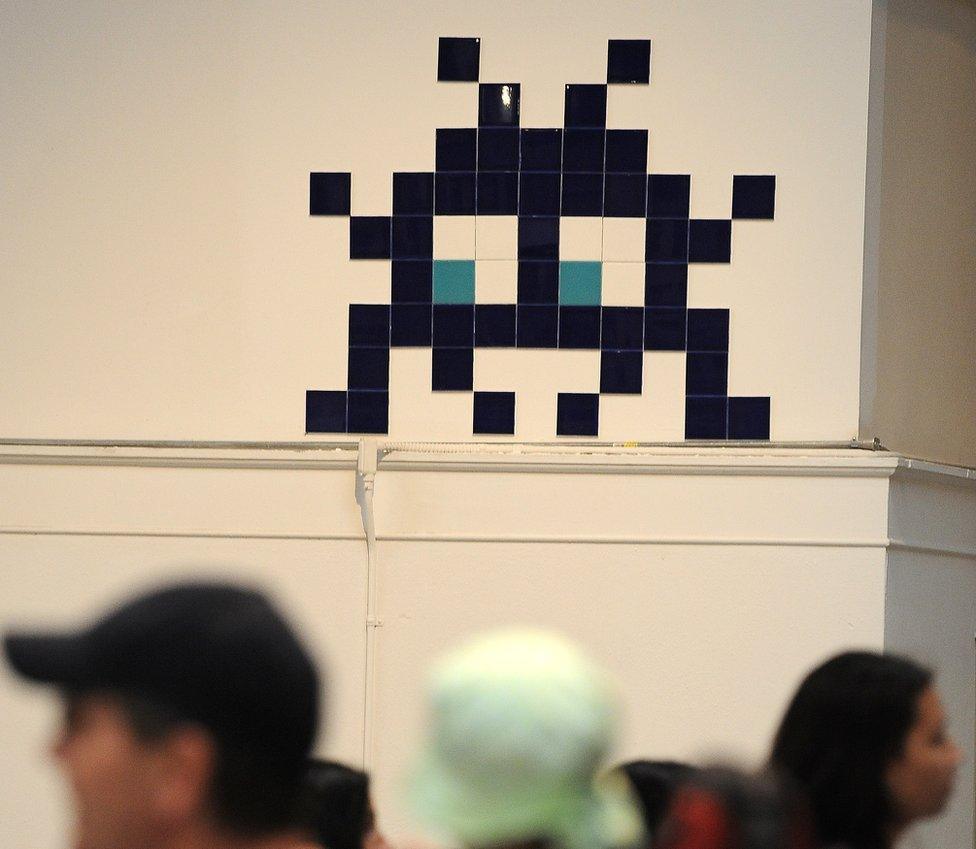 A work by French street artist Invader is on display at the 'Art In The Streets' exhibition inside the Museum of Contemporary Art (MOCA) in Los Angeles in 2011.