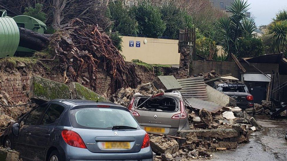 Cars damaged by the storm