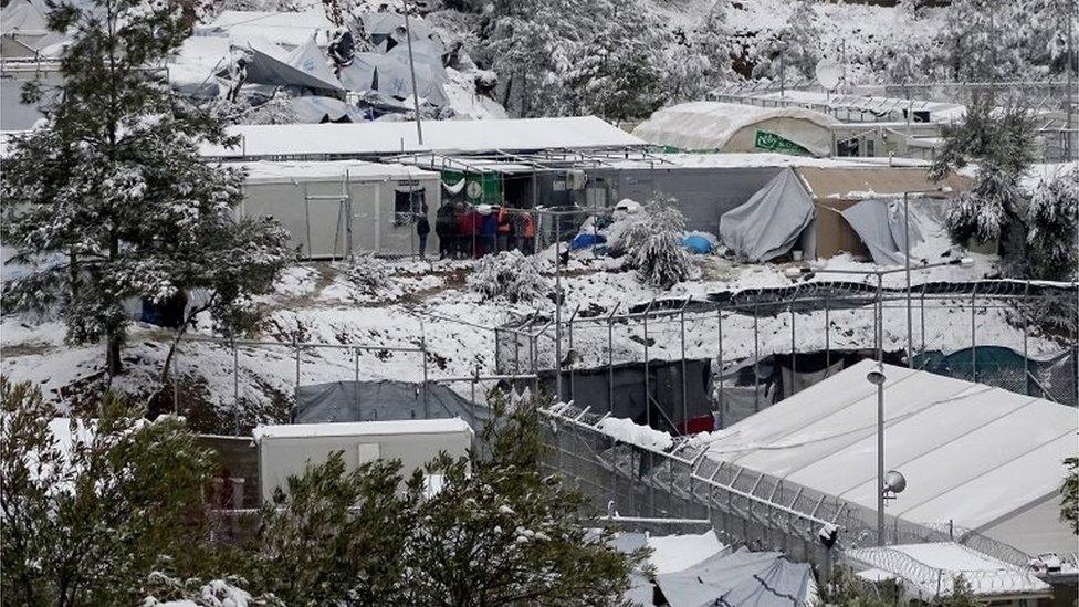 Snow covers tents on the Greek island of Lesbos, 7 January 2017