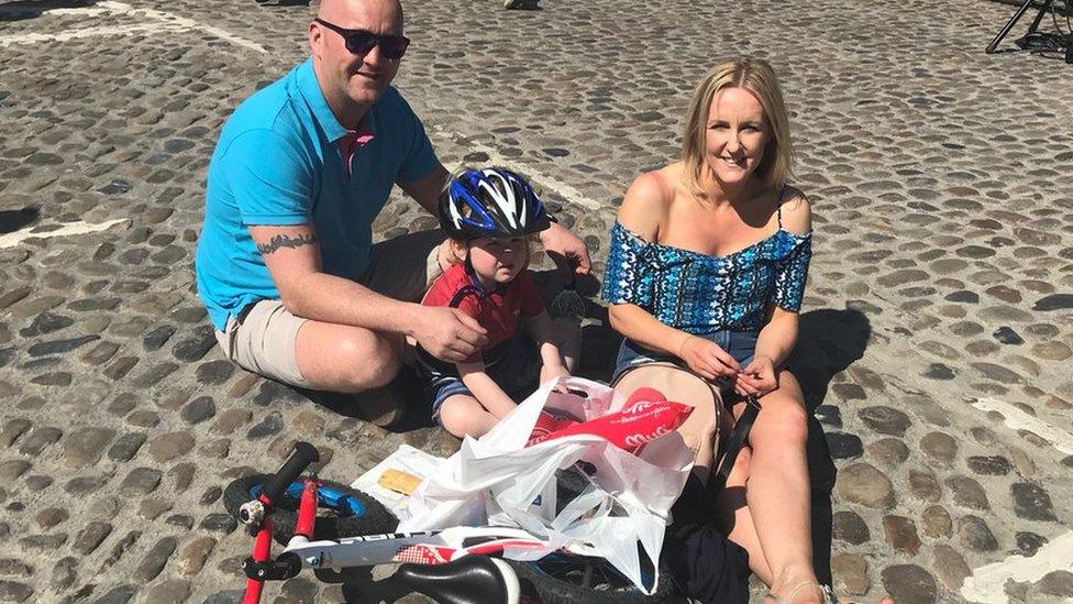 A family watch the race with a picnic in Richmond