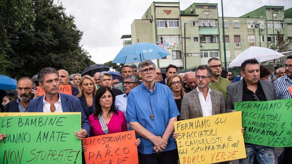 Parish priest Maurizio Patriciello marches with politicians and activists during the demonstration of solidarity for victims of sexual violence on August 29, 2023 in Caivano, Italy