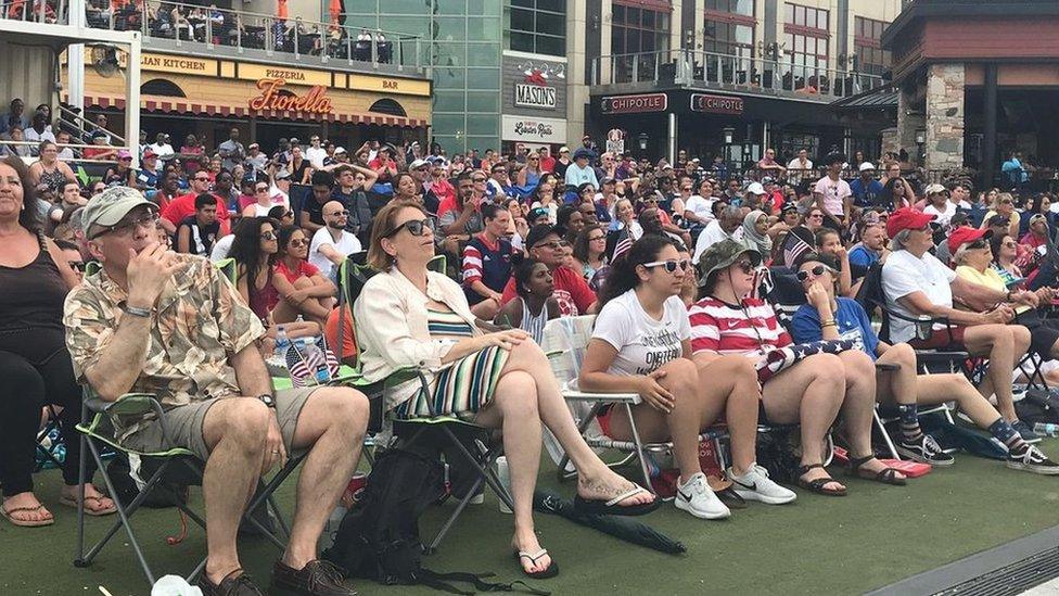 Crowds of people watch the World Cup match