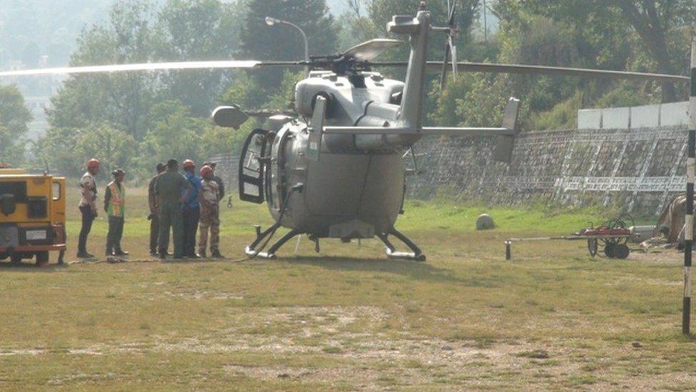 Helicopter and Indian rescue officials