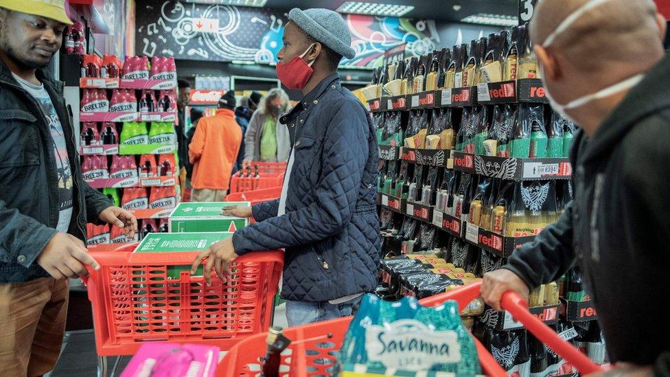 Customers buy alcohol at a liquor shop in Melville, Johannesburg