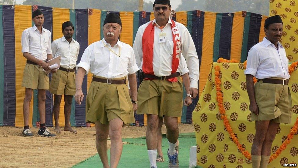 Bhagwat (3rd L), chief of the Hindu nationalist organisation Rashtriya Swayamsevak Sangh (RSS), walks after addressing RSS volunteers during a training camp in Agra, India, in this November 3, 2014 file photo