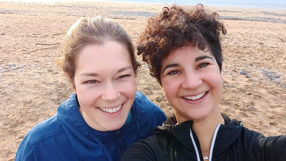 Rachel and her friend on a beach