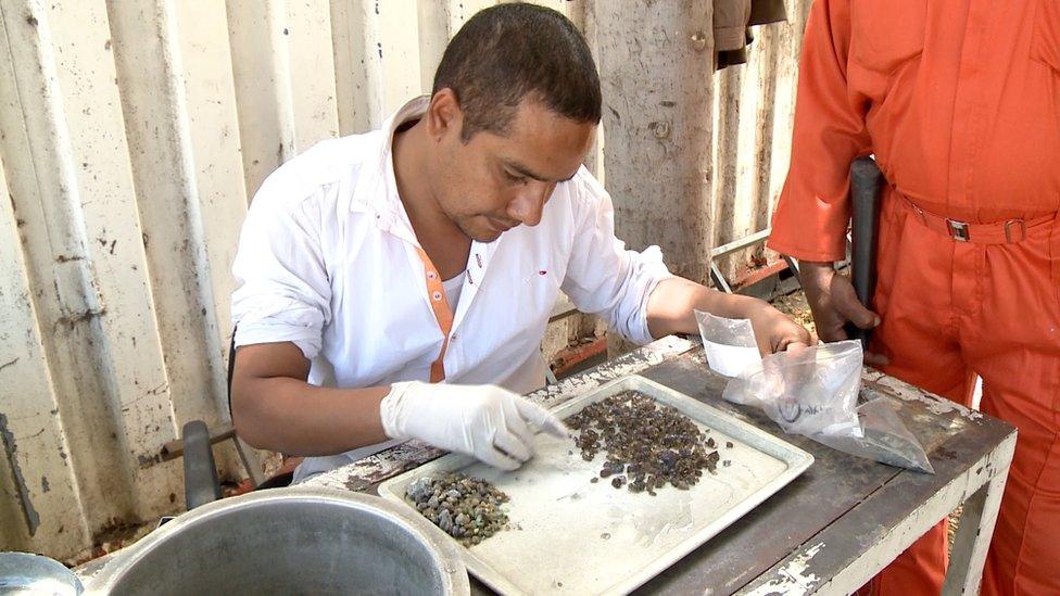 Man sorting Tanzanite at mine site