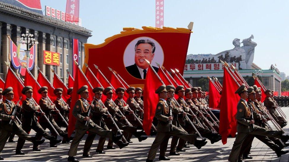 Servicemen march during a military parade marking the 70th anniversary of the foundation of North Korea.