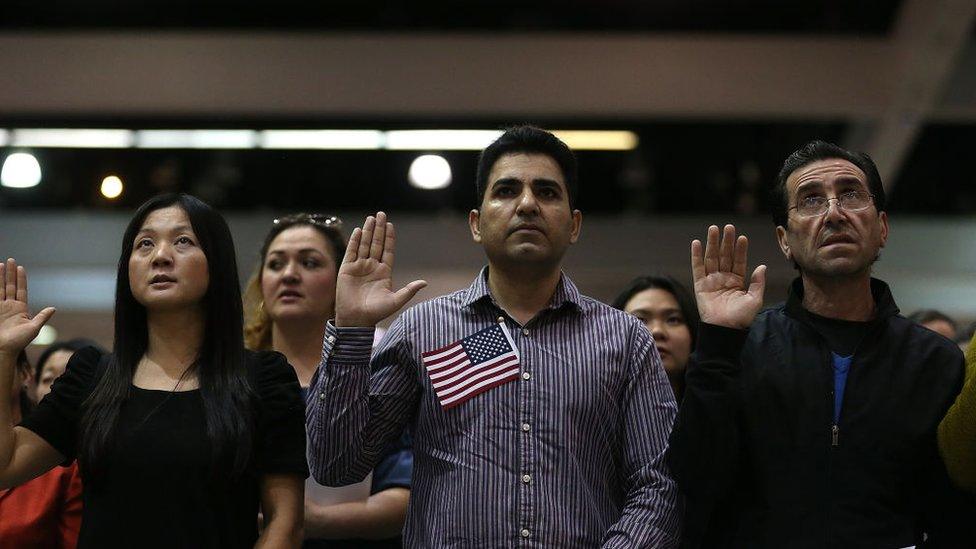 immigrants being sworn in