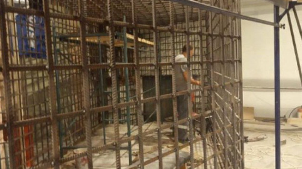 A metal cage inside Mariupol's philharmonic hall