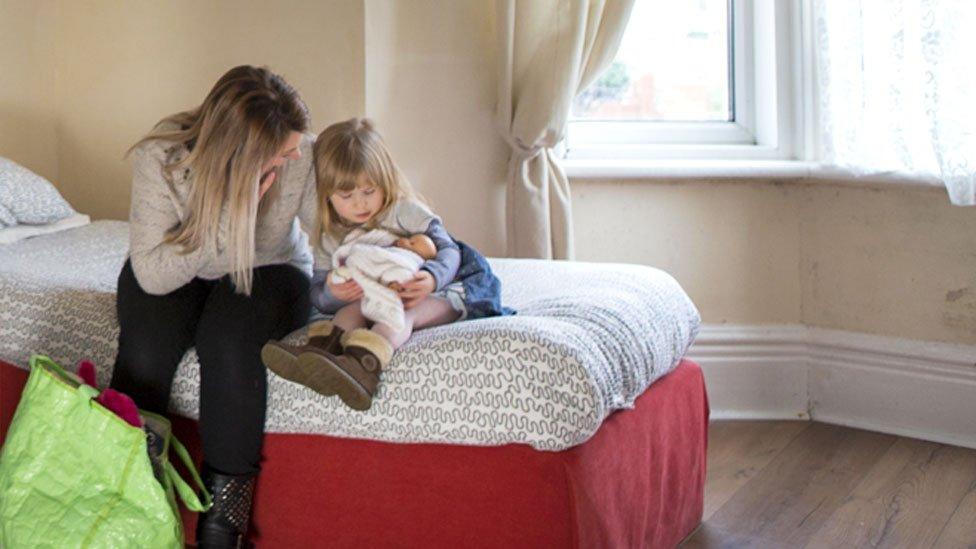 A woman and child in a shelter (stock image)