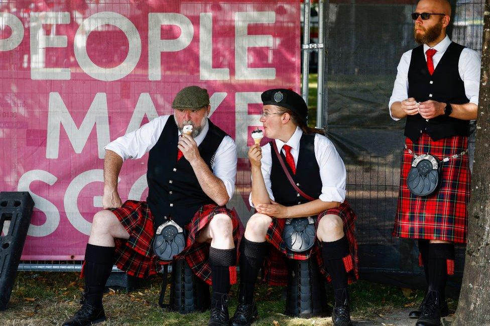 Band members eat ice cream cones