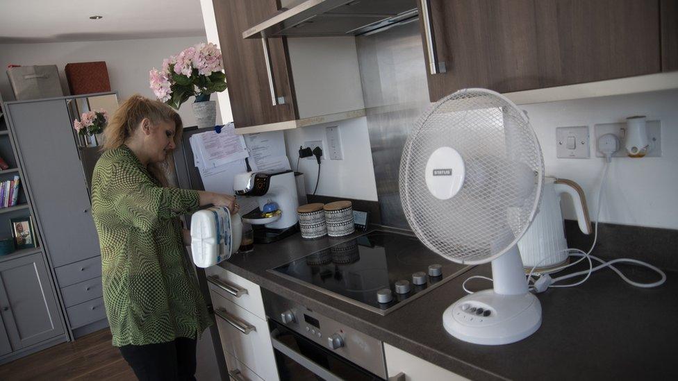 Jorda in her home in Harlsden, London. She is making a coffee in her kitchen