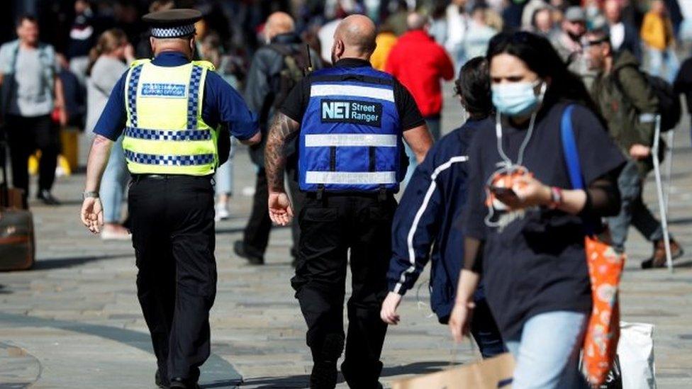 A street ranger and a police community support officer patrol Newcastle