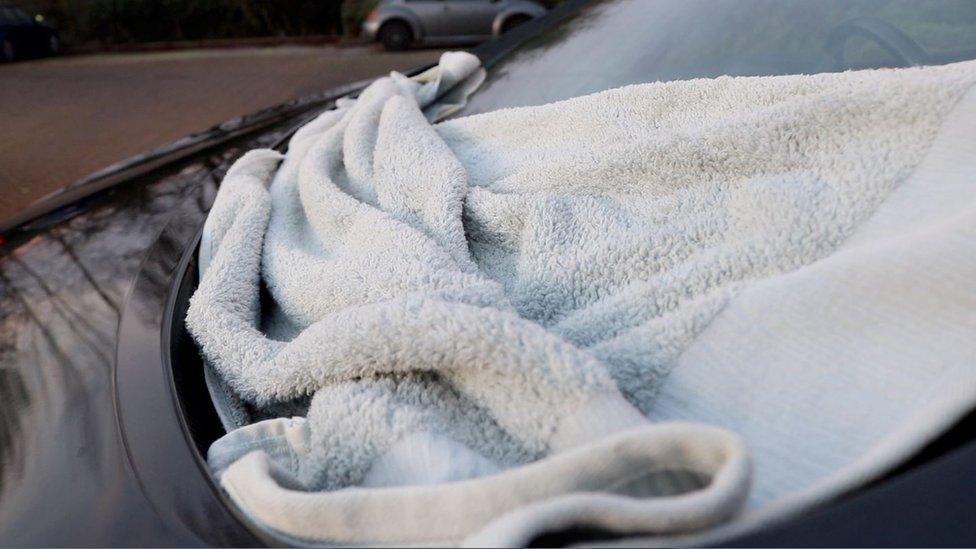 A towel over a windscreen