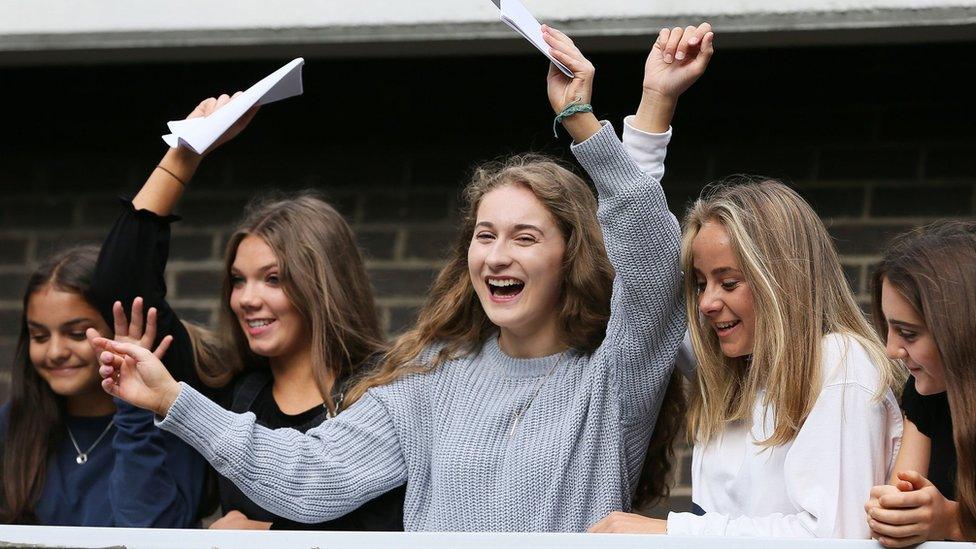 Students at Victoria College in Belfast celebrating after receiving their GCSE results