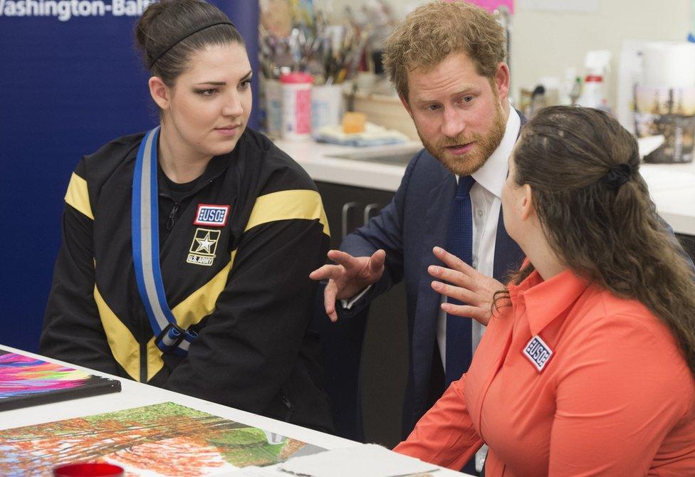 Prince Harry with two injured servicewomen at an art therapy class at Fort Belvoir