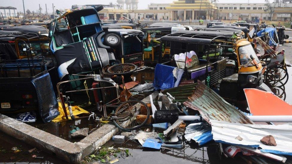 Damaged auto rickshaws are pictured in a pile in Puri, 4 May 2019