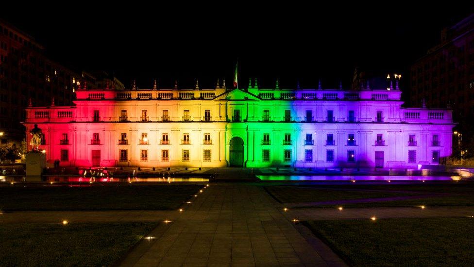 View of La Moneda presidential palace illuminated after the passing of a bill to legalize same-sex marriage in Chile, in Santiago, on December 7, 2021