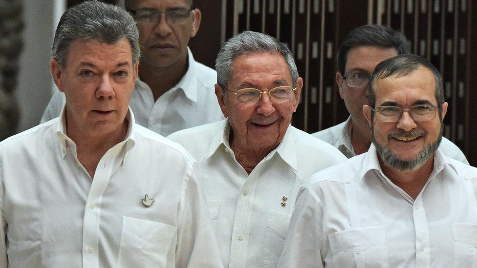 Cuban President Raul Castro, Colombian President Juan Manuel Santos and Timochenko, all dressed in white