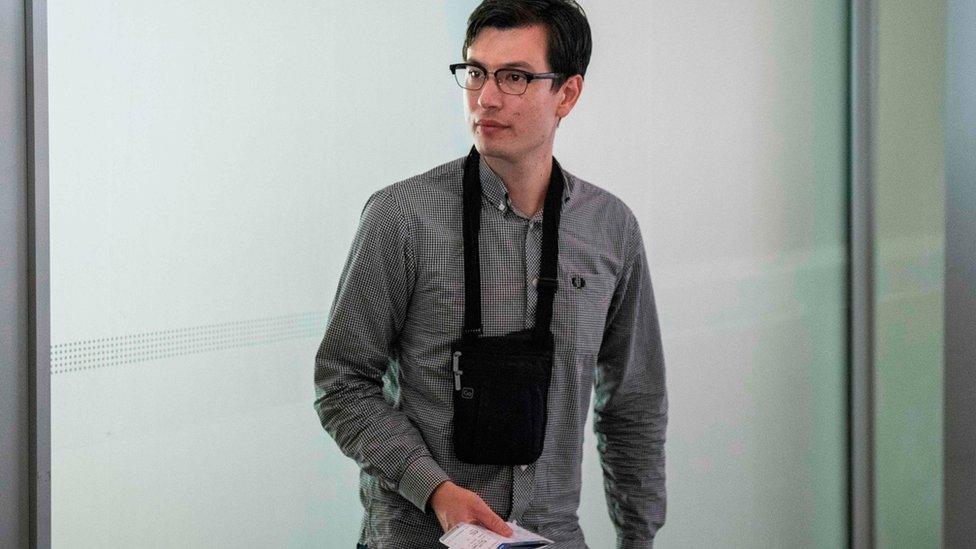 Alek Sigley, an Australian student, in Beijing International airport with his ticket