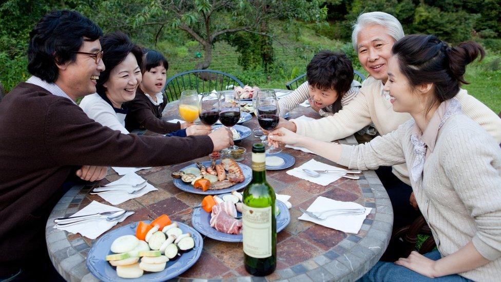 South Korean family chinking glasses