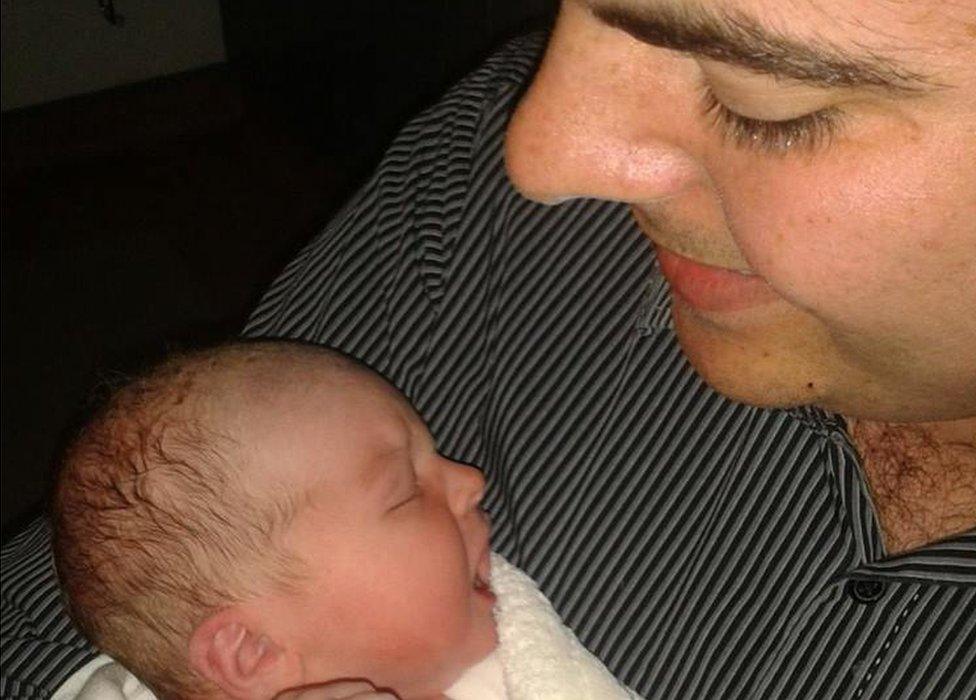 Dad Jude Morrow with newborn baby