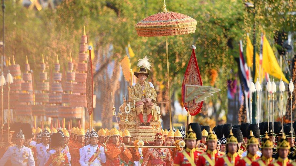 Thailand's King Maha Vajiralongkorn is carried in a golden palanquin during the coronation procession in Bangkok on May 5