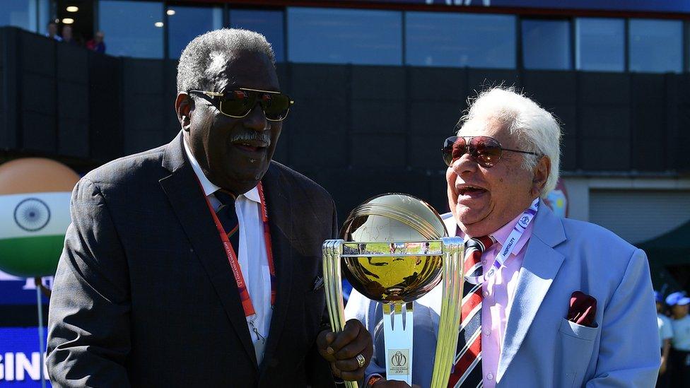 Former West Indies Cricketer Clive Lloyd and Former India Cricketer Farokh Engineer carry out the trophy prior to the national anthems