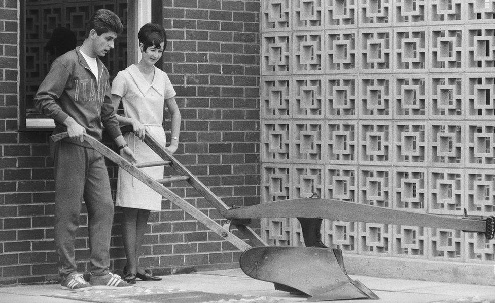 Gianni Rivera, a member of the Italian World Cup squad, examines a plough in July 1966. (Photo by Central Press/Hulton Archive/Getty Images)