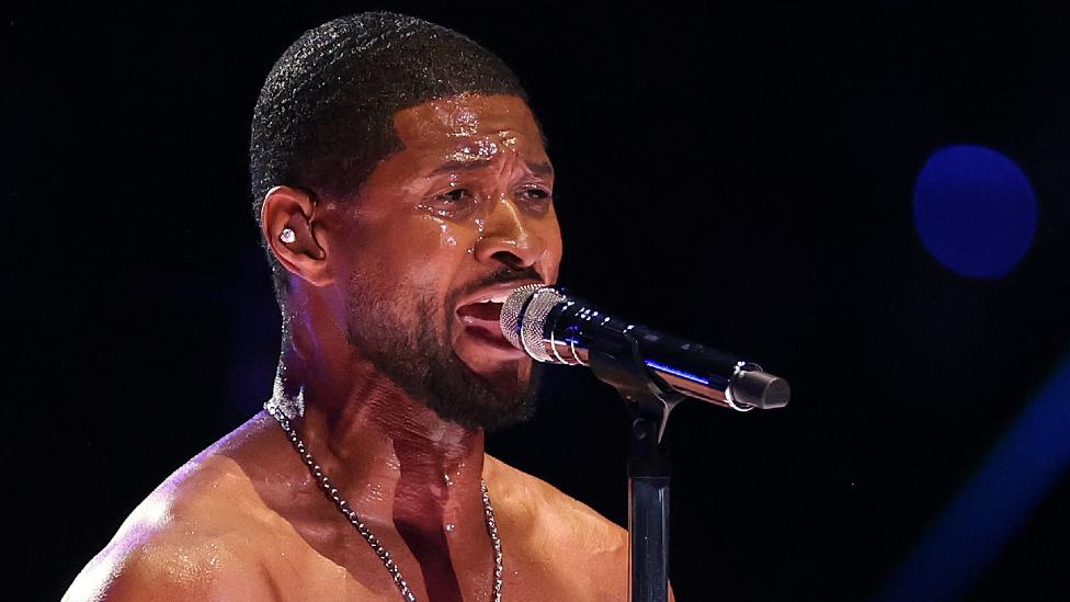 Usher performs on the field during the Apple Music Super Bowl LVIII Halftime Show at Allegiant Stadium on February 11, 2024 in Las Vegas, Nevada