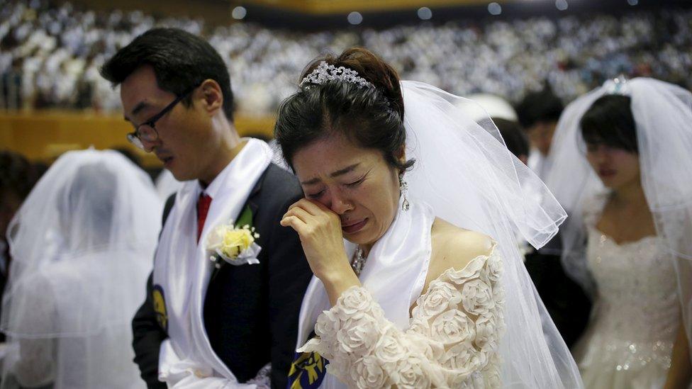 Newlywed couples attend a mass wedding ceremony of the Unification Church at Cheongshim Peace World Centre in Gapyeong, South Korea, 20 February