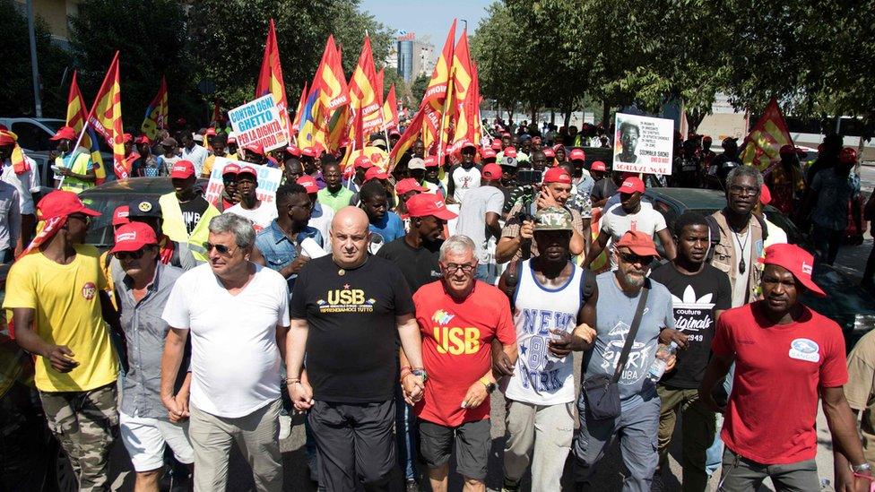 Union members marching with migrant workers in Foggia August 2018