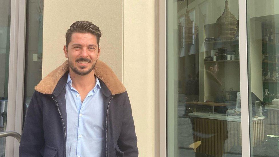 Leo Mometti stands outside his business which is affected by the power cut at Hallsville Quarter