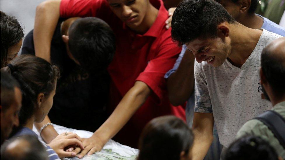 Family of Claiton Antonio Ribeiro, one of the victims killed in a shooting at Raul Brasil School, attends the collective funeral in Suzano