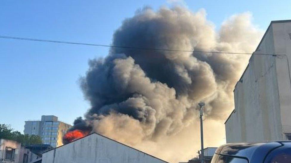 Smoke and fire in the roof of the building