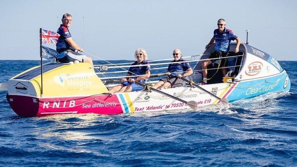 Four men in a rowing boat in the Atlantic Ocean