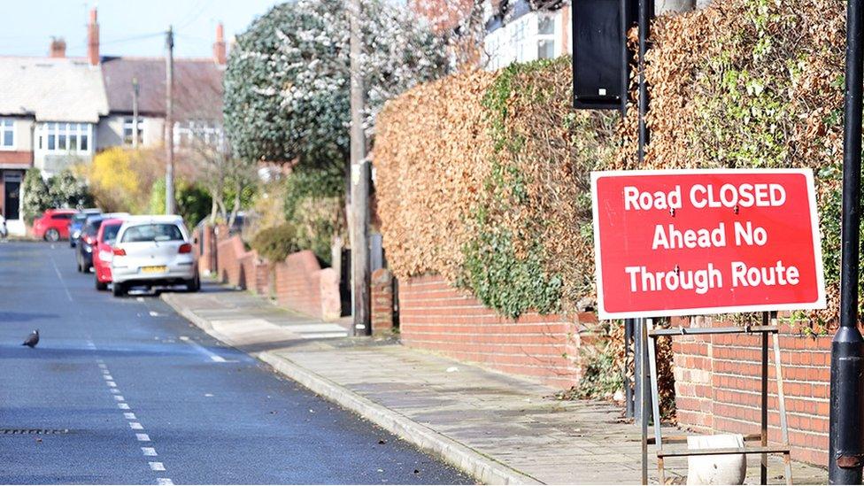 Residential street in Jesmond with road closure sign