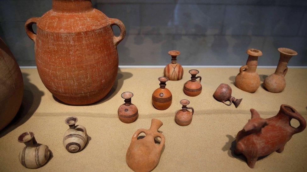 Clay items unearthed during excavations at the first-ever Philistine cemetery in Ashkelon National Park, are displayed at an exhibition in the Rockefeller Museum in Jerusalem July 6, 2016.