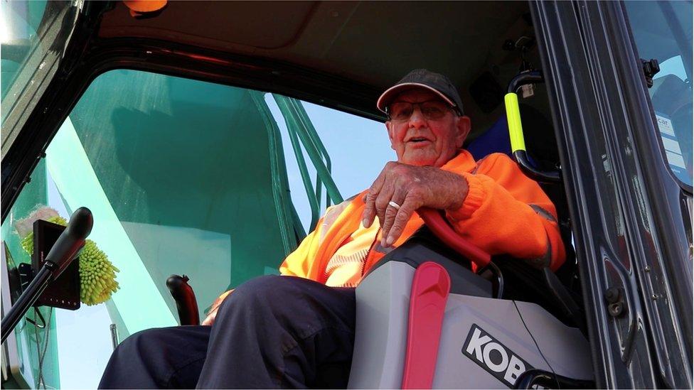 Jack in the cab of a construction vehicle