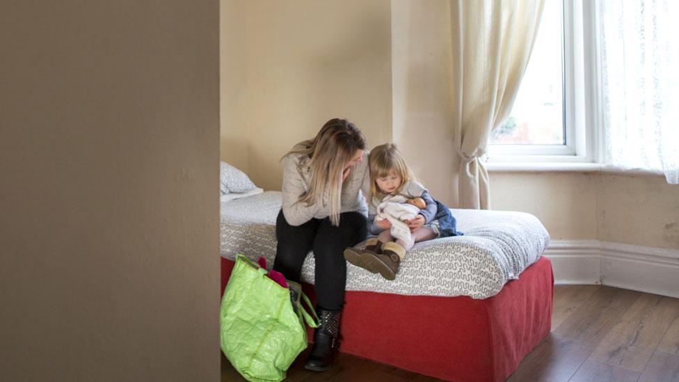 A woman and child in a shelter