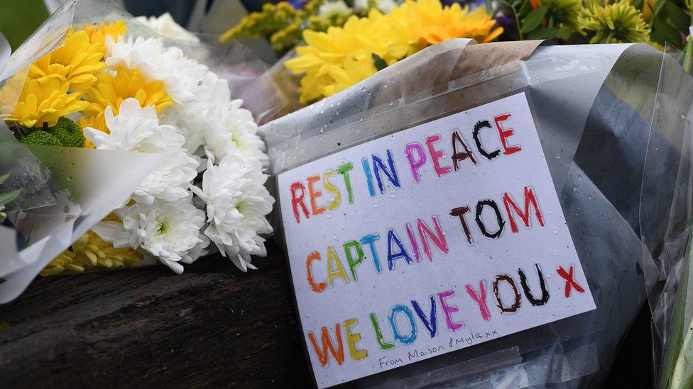 Floral tributes outside the home in Marston Moretaine, Bedfordshire, of 100-year-old charity fundraiser Captain Sir Tom Moore