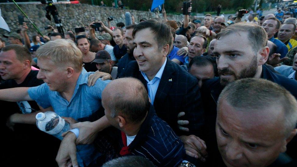 Former Georgian President Mikheil Saakashvili is surrounded by his supporters as he arrives at a checkpoint on the Ukrainian-Polish border in Krakovets, Ukraine September 10, 2017