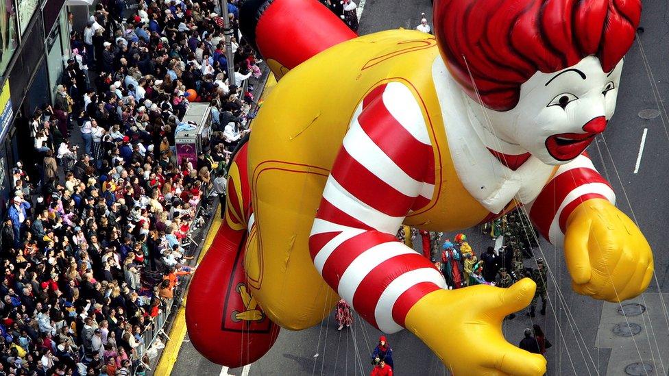 The Ronald McDonald balloon floats down Broadway