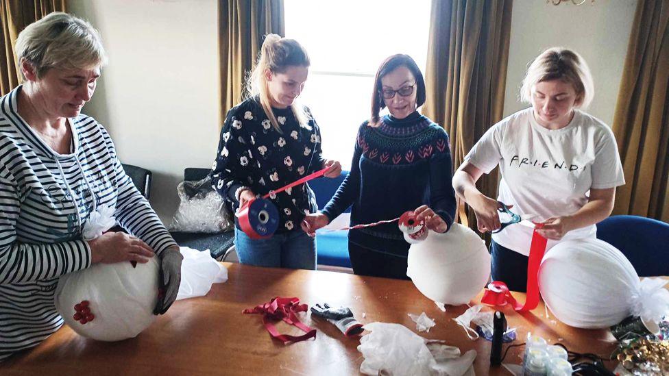 Christmas tree decorations being created