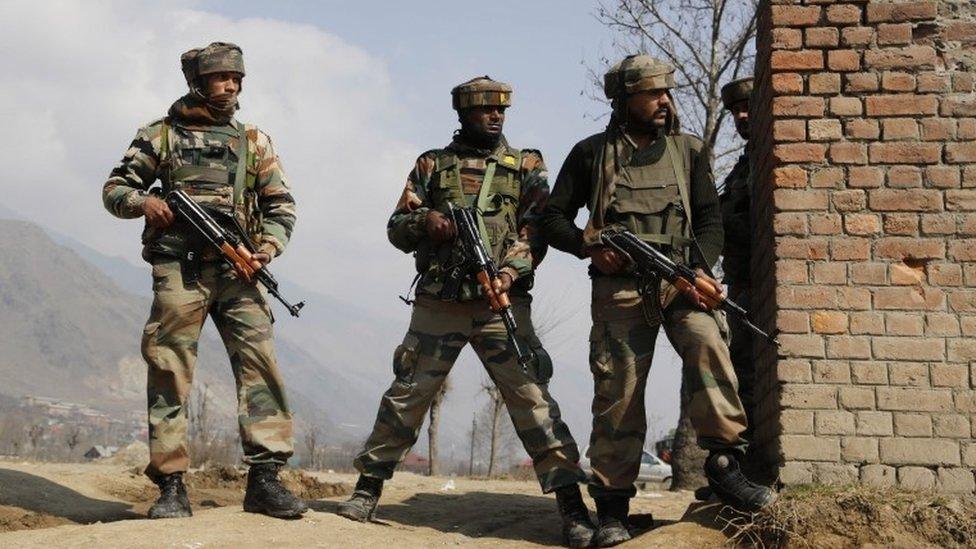 Indian Army soldiers take position during a gunbattle between Indian security forces and Kashmiri rebels in Pampore, near Srinagar, Indian controlled Kashmir, Indian-controlled Kashmir, Monday, Feb. 22, 2016