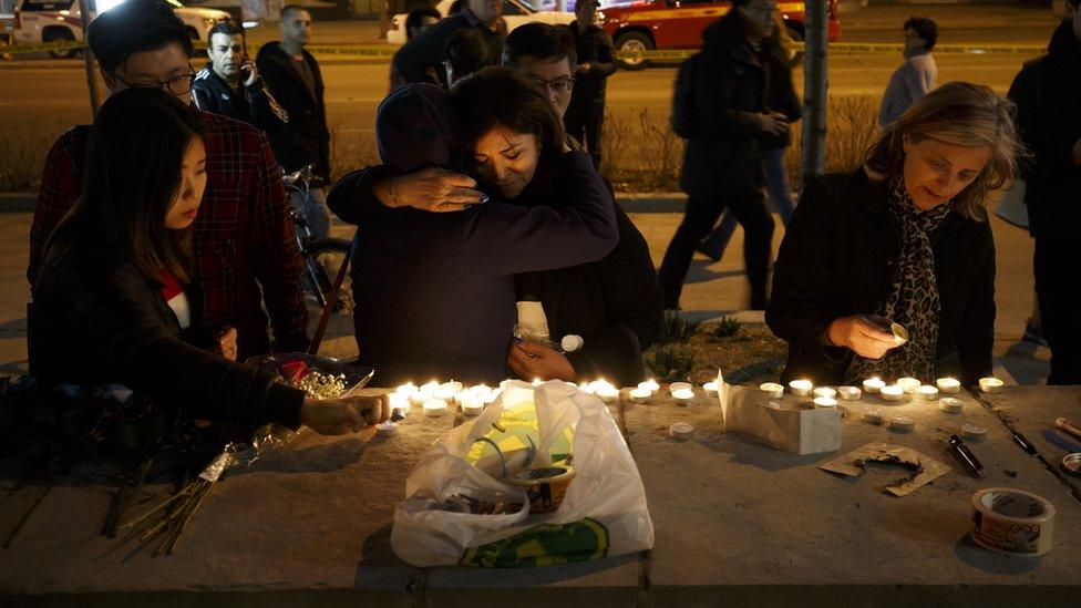 Mourners leave candles and messages on Yonge Street after Monday's attack