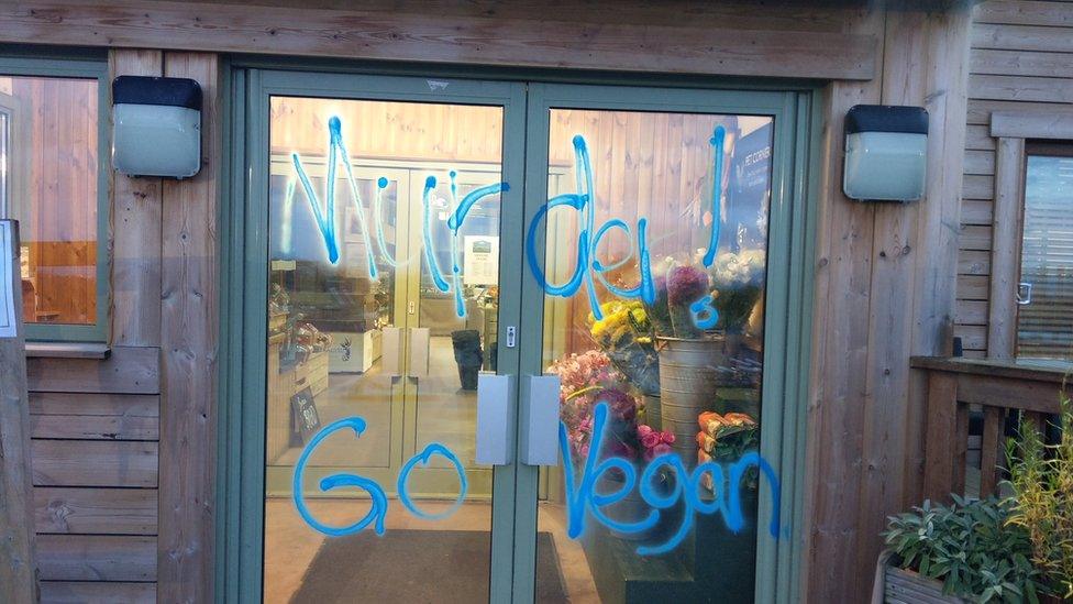 Graffiti on the front door of Greendale Farm Shop