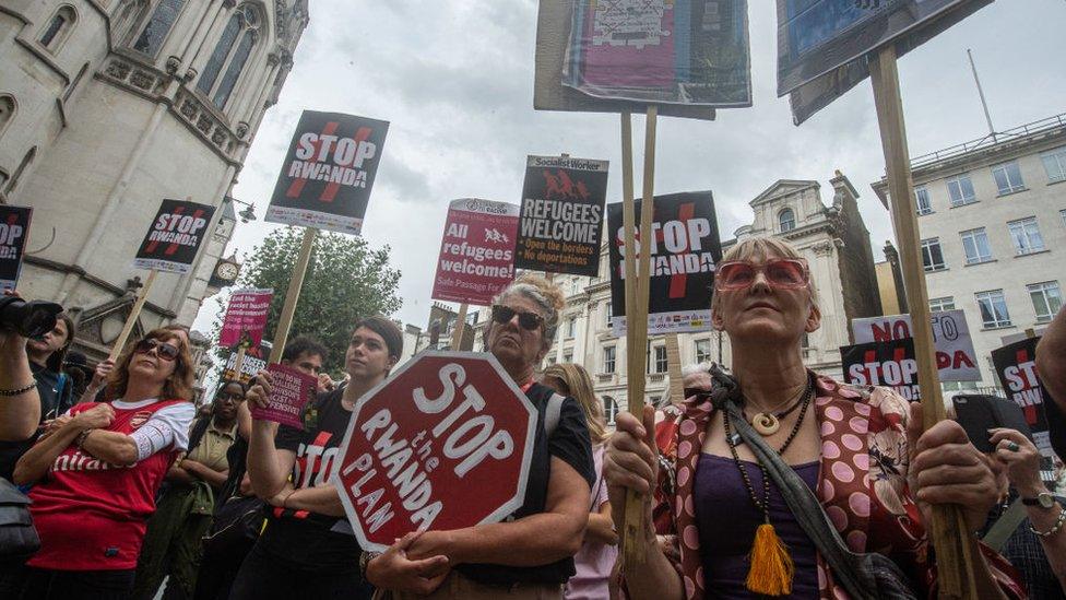 Protesters outside the High Court in London