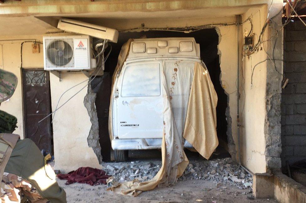 An IS car bomb, primed, and hidden inside a village home